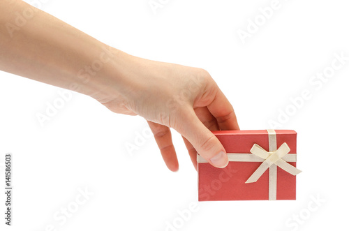 hand of young girl holding gift box.