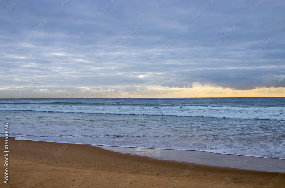  Beach and Ocean Against Cloudy Sky on Horizon