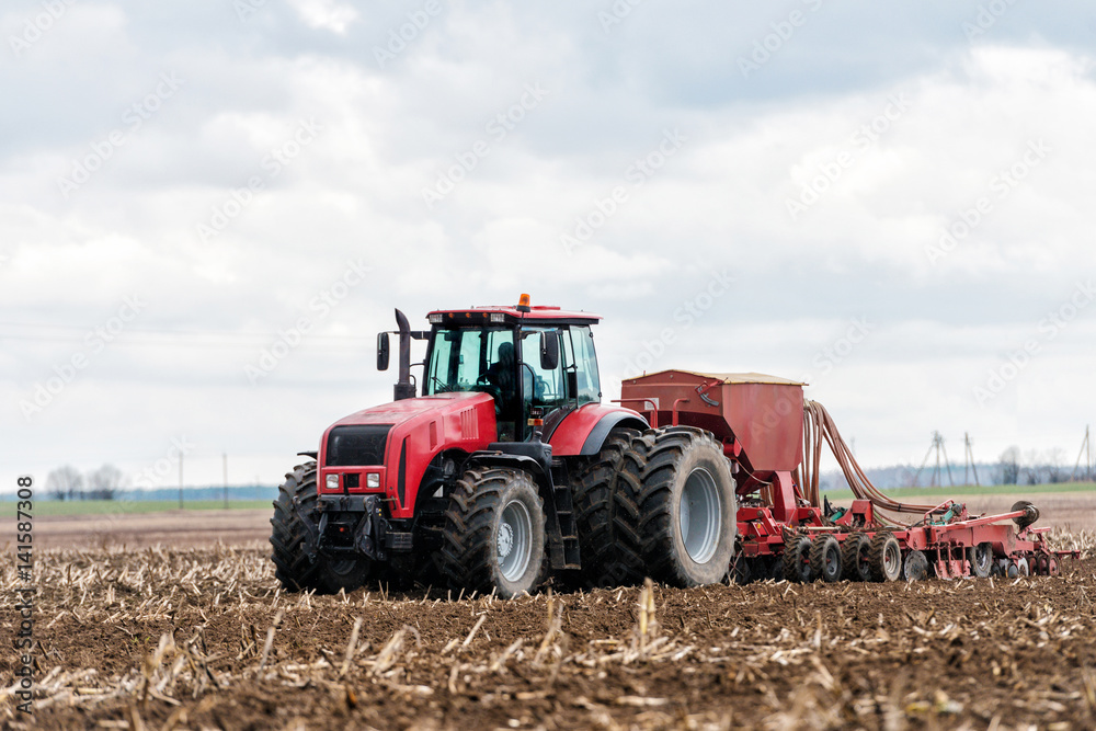 Farmer tractor working in the field. Spring time for sowing. Planting crops. Farmer tractor working in the field. Spring time for sowing. Planting crops.