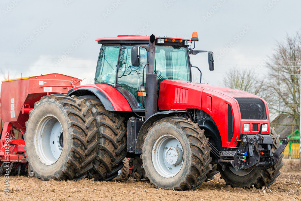 Farmer tractor working in the field. Spring time for sowing. Planting crops. Farmer tractor working in the field. Spring time for sowing. Planting crops.
