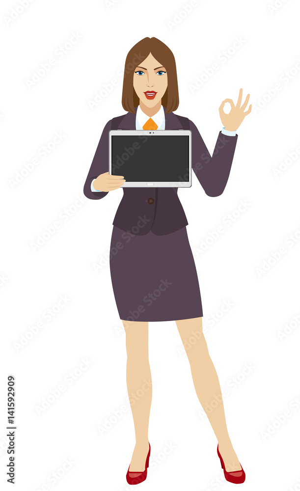 Businesswoman holding a digital tablet PC and showing a okay hand sign Businesswoman holding a digital tablet PC and showing a okay hand sign