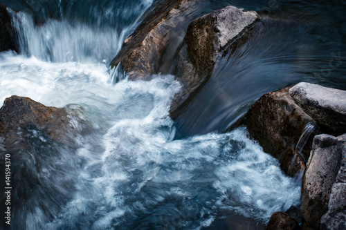 Water flows between stones