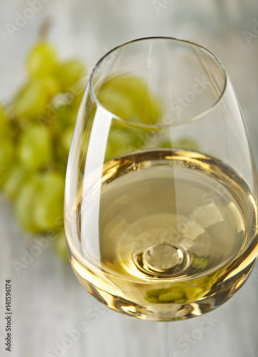 Wine. Grapes. Glass with white wine