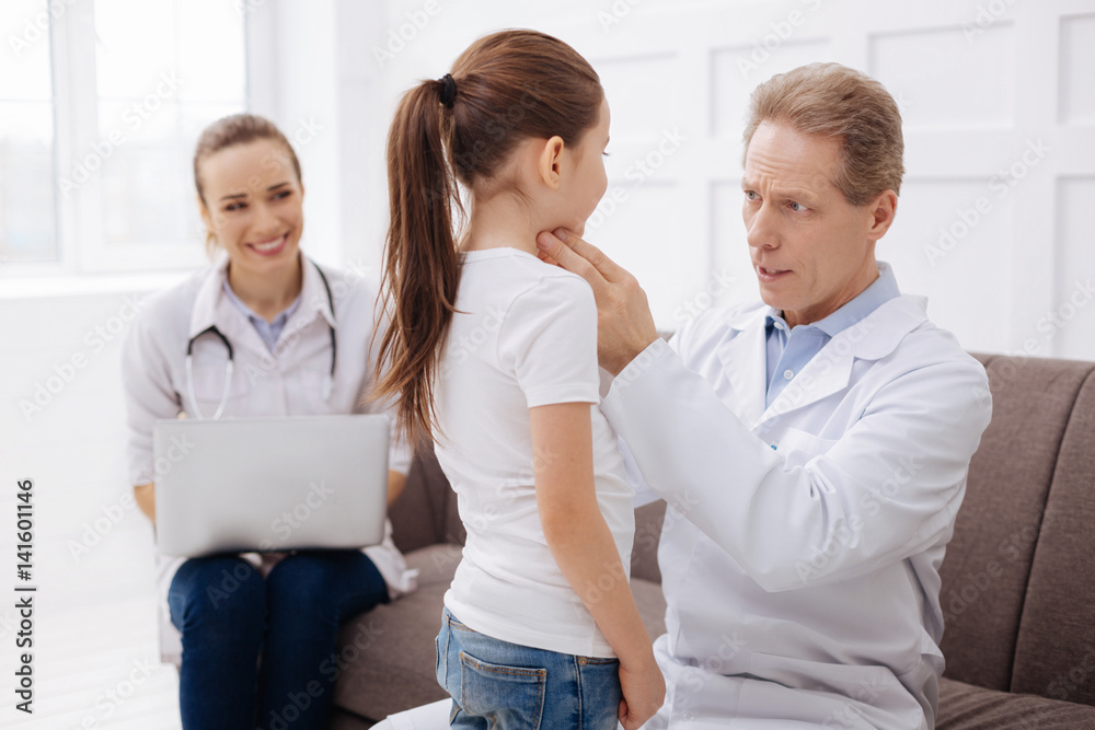 Private doctor and a girl having a serious conversation Private doctor and a girl having a serious conversation