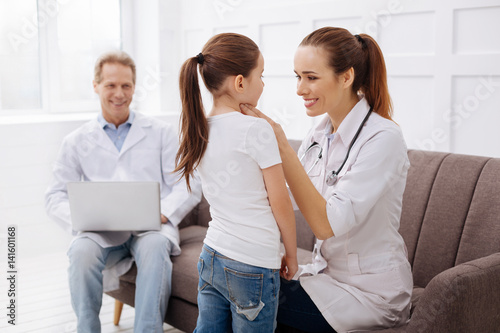 Experienced pediatrician and her patient having girls talk