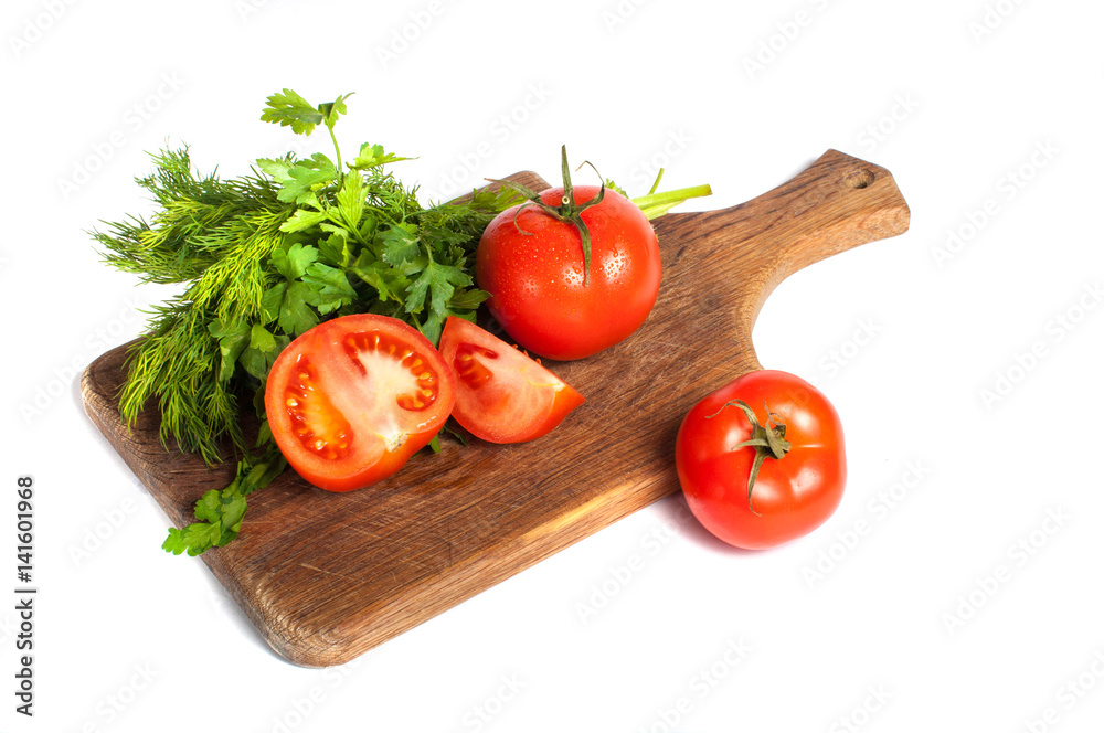 Red tomatoes with parsley on a wooden board Red tomatoes with parsley on a wooden board