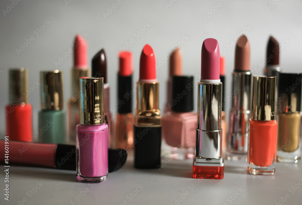 Set of multi-colored lipsticks and nail polishes Set of multi-colored lipsticks and nail polishes