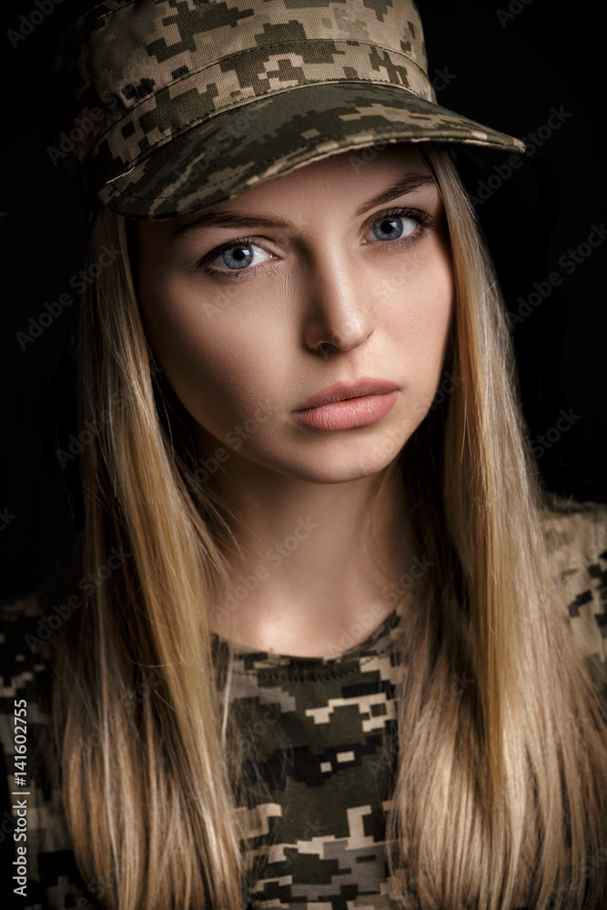 portrait of beautiful woman soldiers in military attire on black background portrait of beautiful woman soldiers in military attire on black background