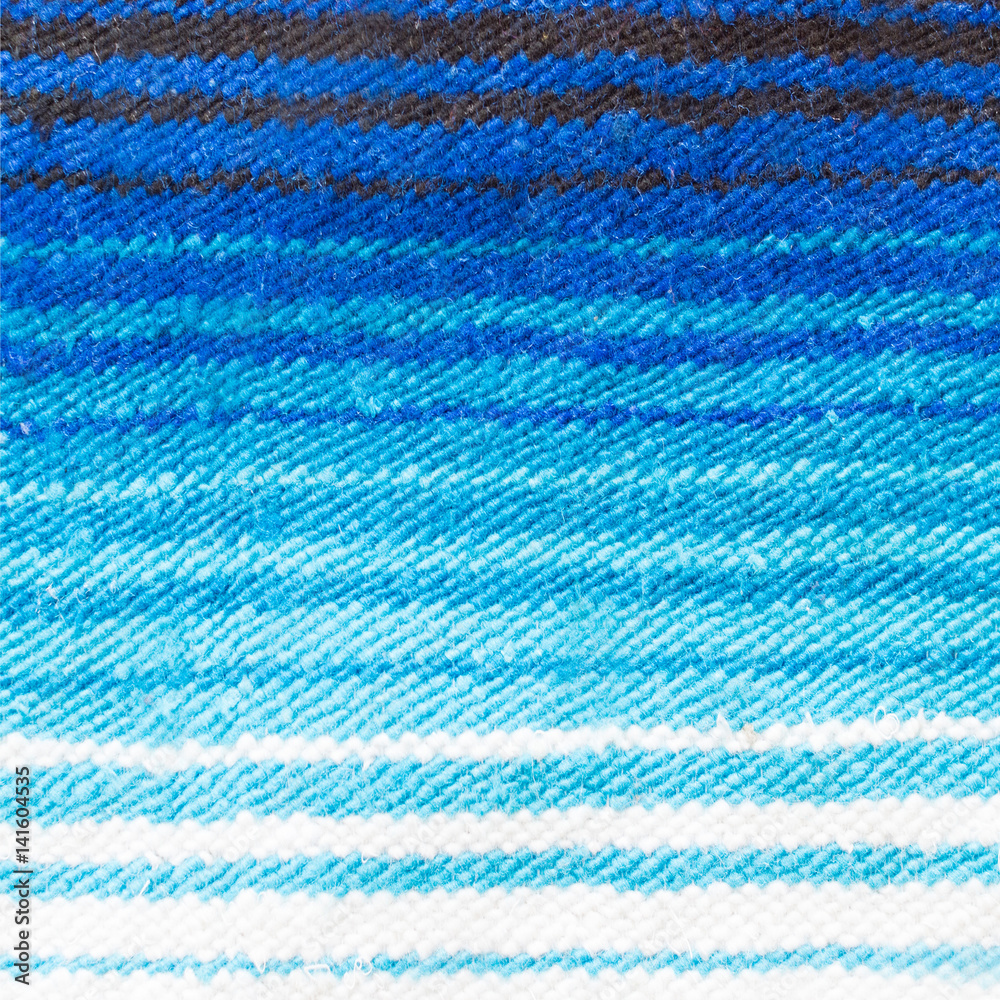 wool textile - fashion background - close up of hand woven wool fabric wool textile - fashion background - close up of hand woven wool fabric