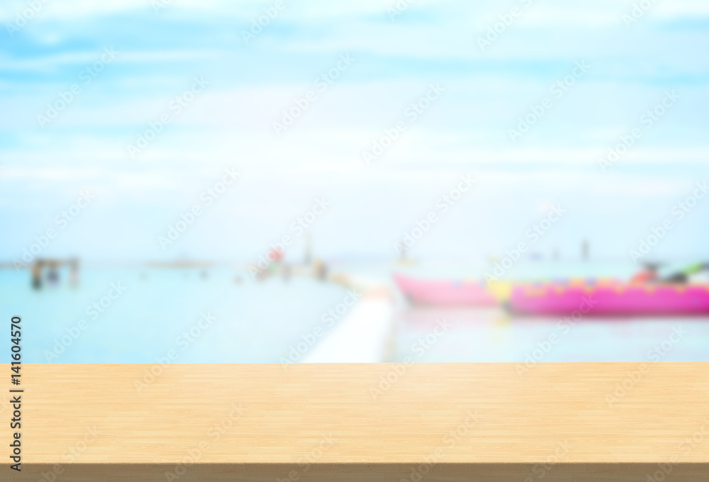Laminate table top on blurred seascape background can put or montage your products