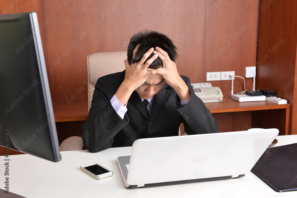 Young businessman working in the office Young businessman working in the office