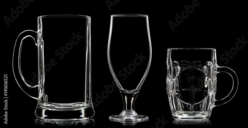 Silhouette of different glasses on black background