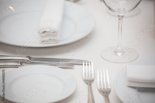 detail of a dining table set up with wine glasses