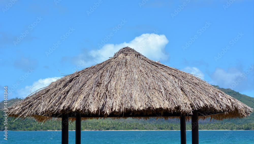 Water bungalow straw roof tropical island background