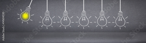 Great Idea and Creativity Concept with light bulbs on chalkboard background