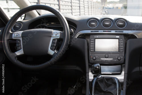 dashboard of a recent car with a tablet inside © OceanProd