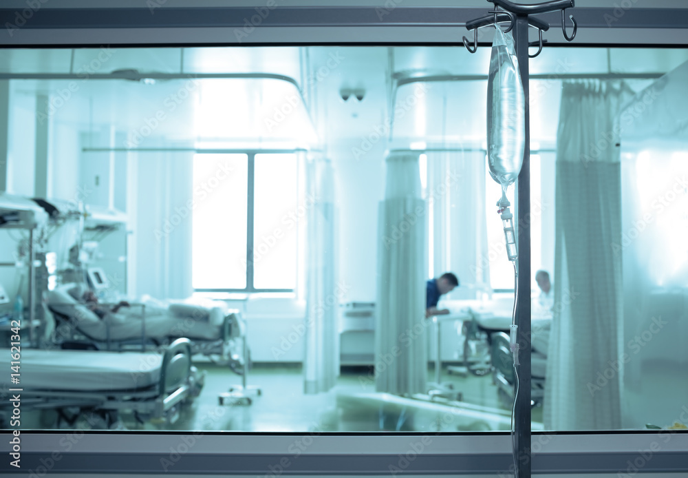 Intensive care unit ward behind the window glass Stock Photo | Adobe Stock
