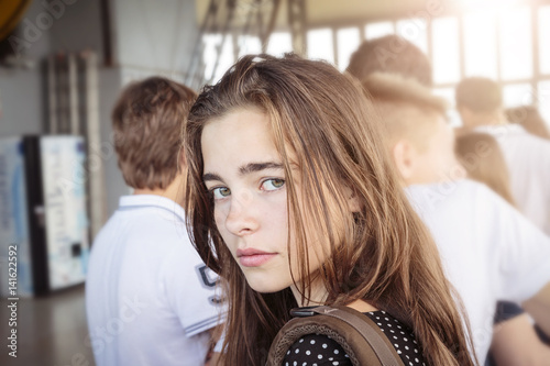 girl at the end of a waiting queue