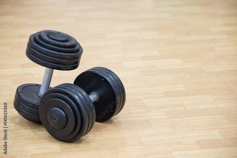 Background on the theme of sport with dumbbells Background on the theme of sport with dumbbells