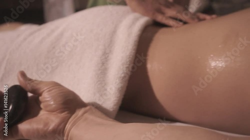 Wallpaper Mural The spa salon has a wellness, Thai massage. Female hands massage the body parts with oil and stones. Torontodigital.ca