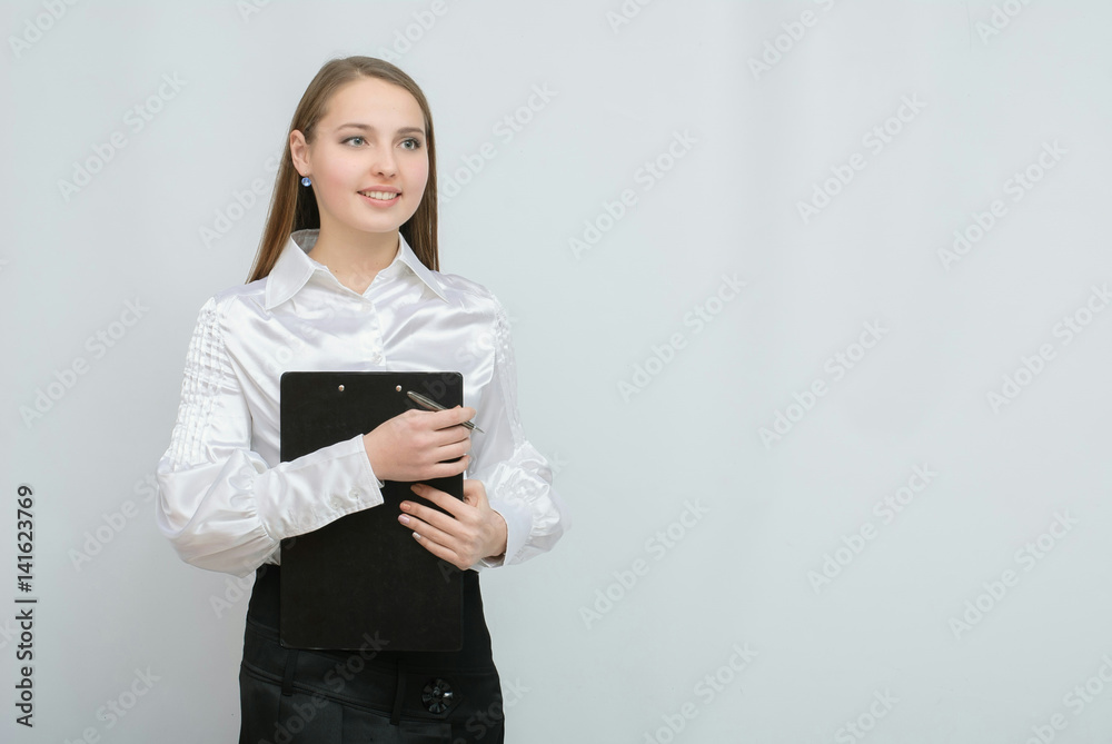 Young pretty business woman with tablet paper isolated on white background Young pretty business woman with tablet paper isolated on white background
