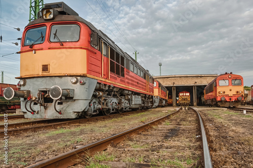 Old diesellocs in a Hungarian railyard.