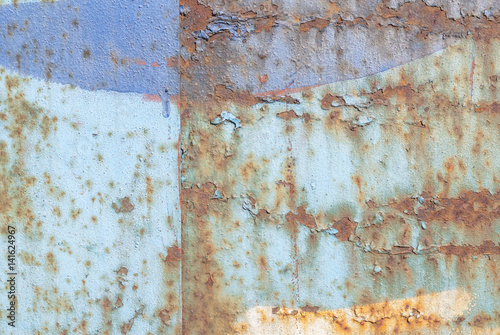 old surface of the metal sheet covered with old paint, texture background