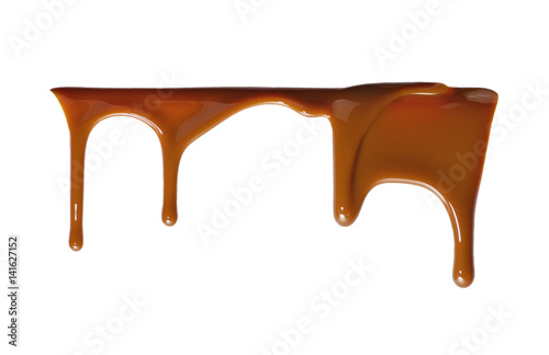 Liquid chocolate flowing downwards isolated on white background.