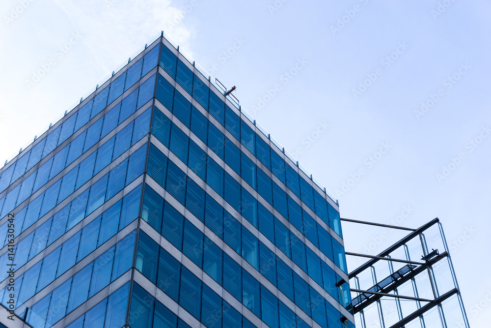 View of a modern glass skyscraper buildings around View of a modern glass skyscraper buildings around
