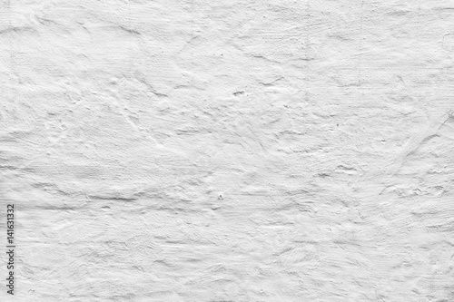Rough concrete wall with white plaster © evannovostro