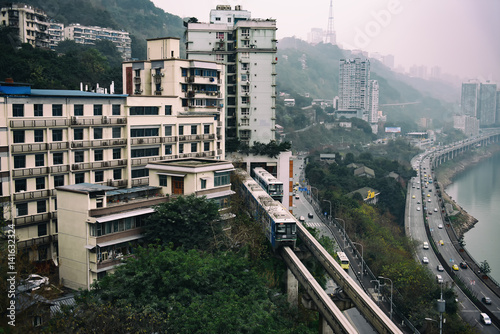 The monorail vehicle was crossing a residence in Chongqing, China. 