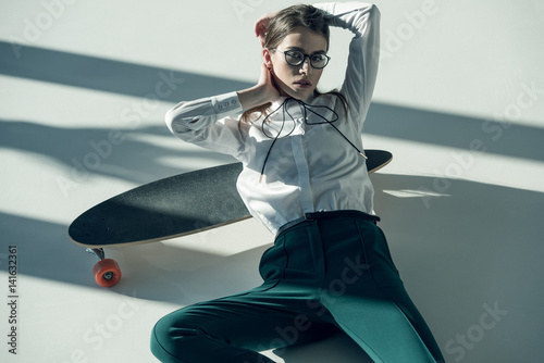 Canvas Print stylish woman with skateboard
