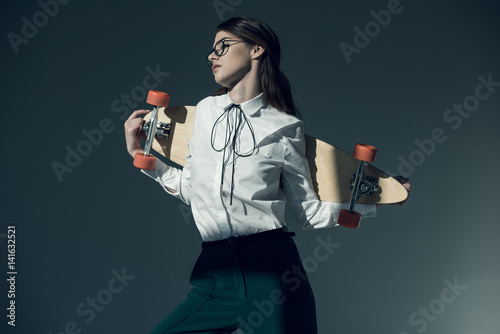 Photography Young woman with skateboard