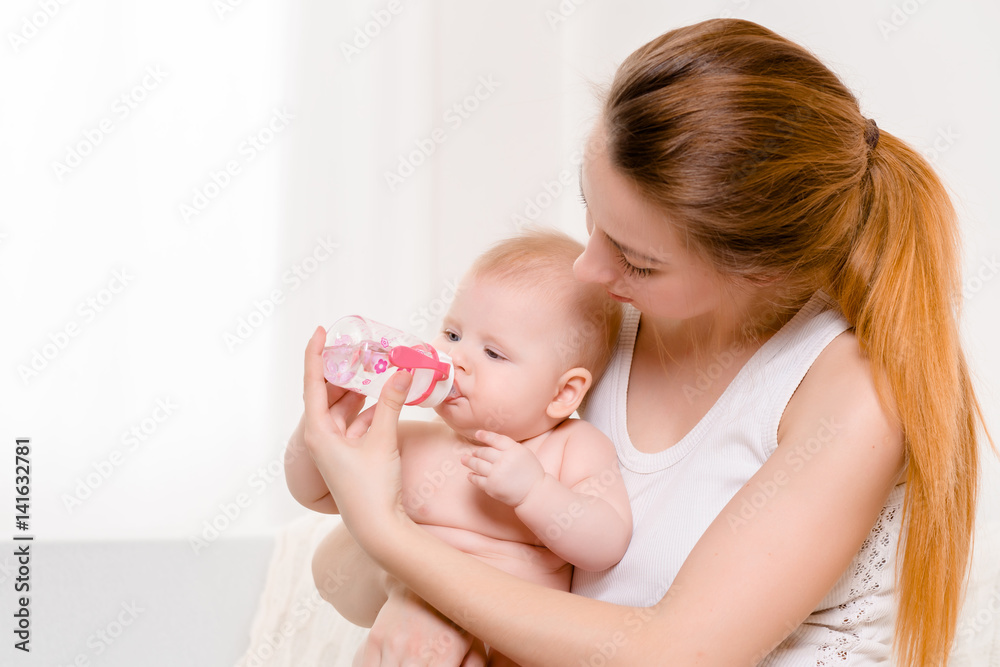 Feeding Baby. Baby eating milk from the bottle. Feeding Baby. Baby eating milk from the bottle.