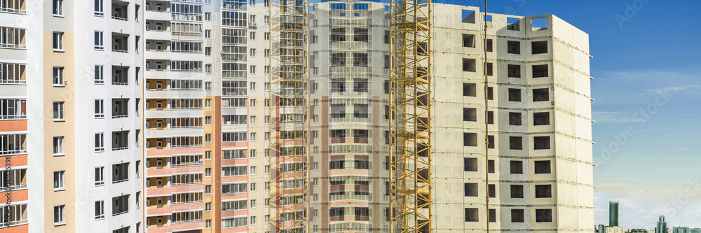 Panorama of the construction of modern concrete buildings
