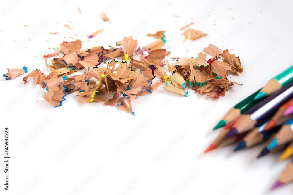 Colored pencils on a white background. Shavings on the back. Colored pencils on a white background. Shavings on the back.