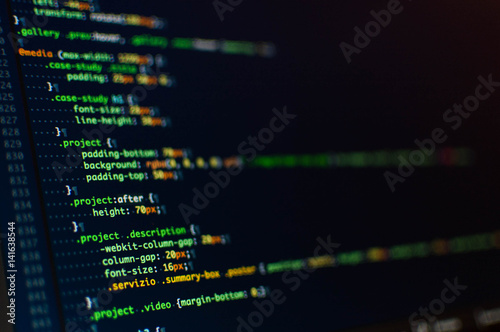 Software development. Software source code. Programming code. Writing programming code on laptop. photo