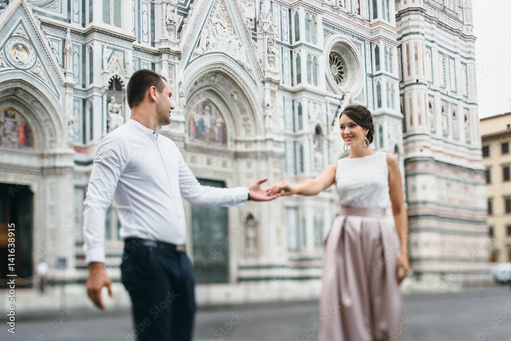 Young couple in love visiting Florence in Italy