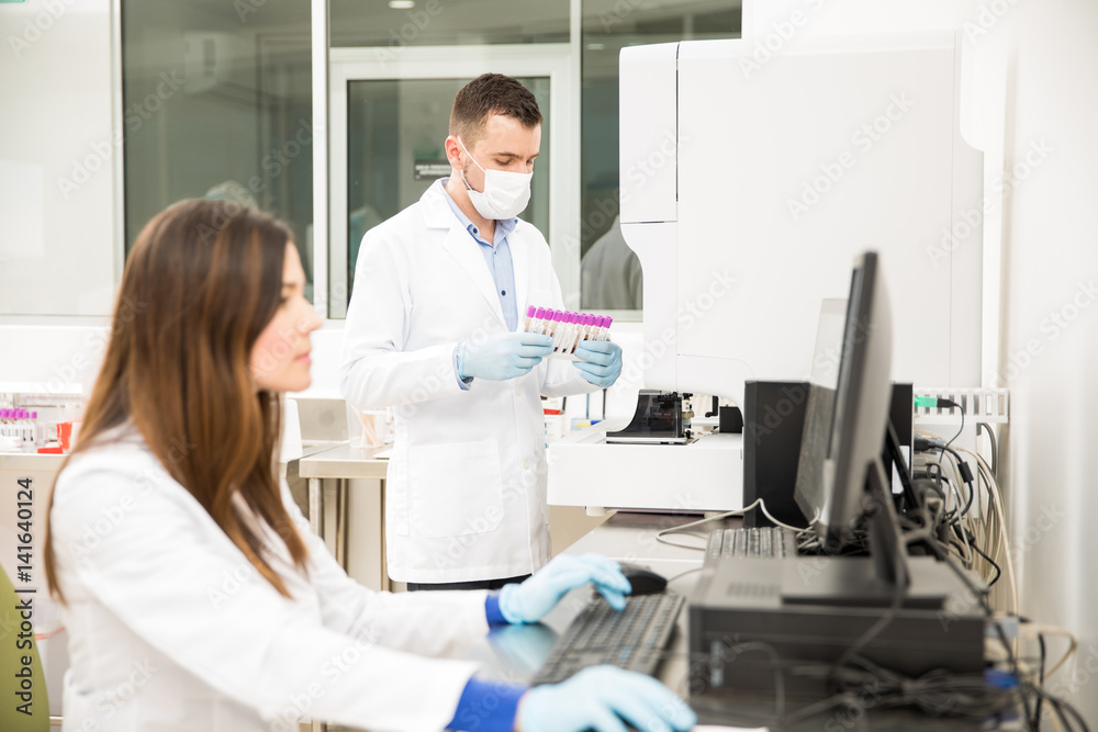 Couple of chemists working in a lab Couple of chemists working in a lab