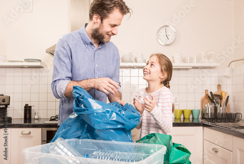 Recycling - family sorting (segregating) household waste