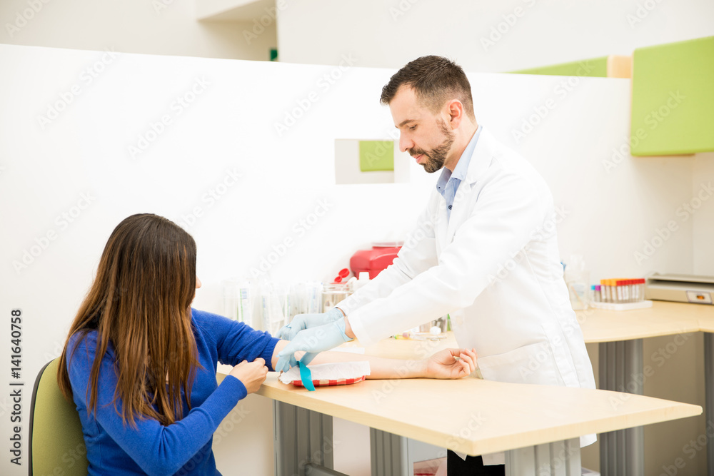 Fototapeta premium Doctor preparing for drawing blood