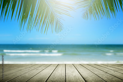 Beach background with palm tree and empty wooden.