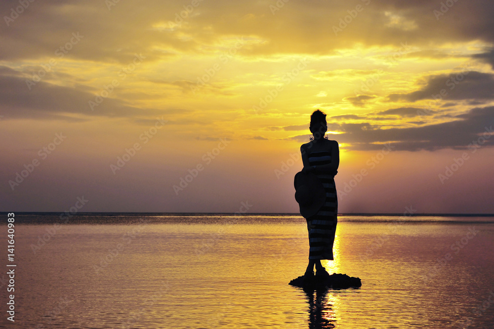 Women in Black Shadow Sea before sunset