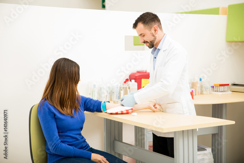 Doctor about to draw blood from patient