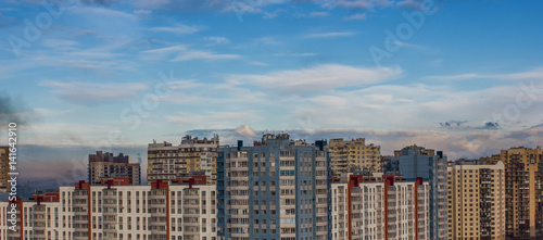 clouds in the blue sky over the city