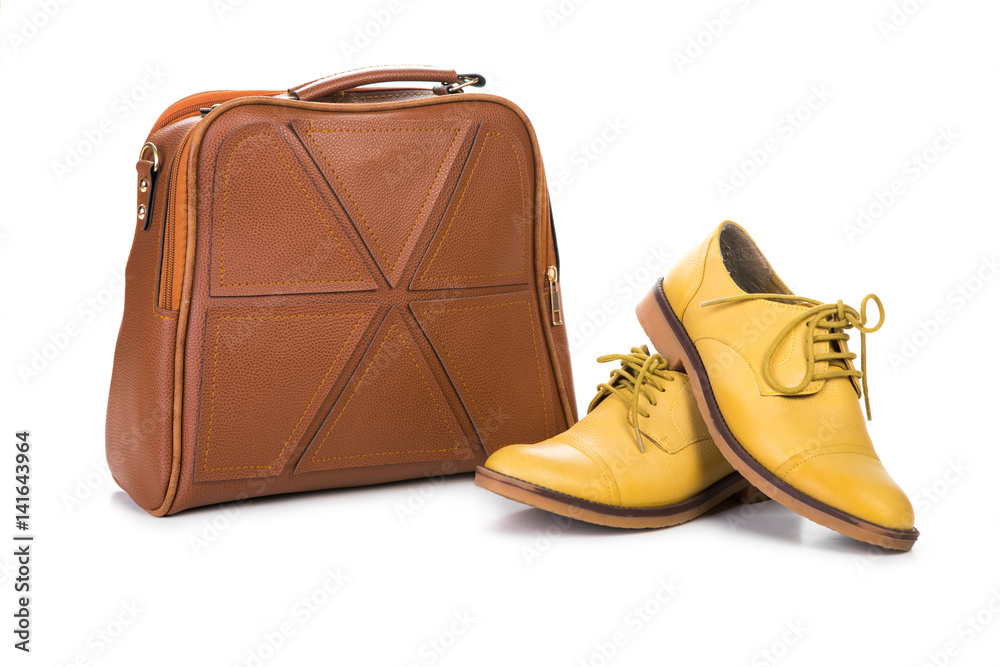 Pair of women shoes and handbag isolated over white Pair of women shoes and handbag isolated over white
