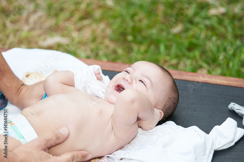 A baby smiling with his mouth open