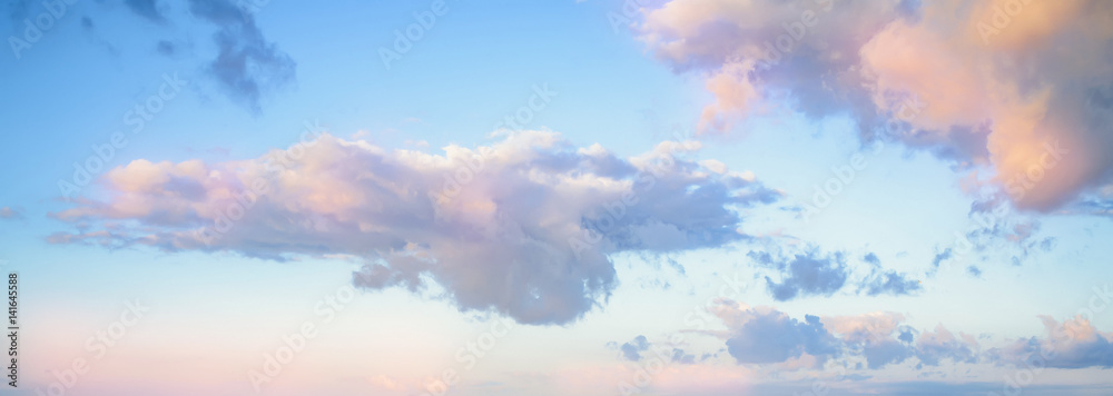 Sky background on sunset. Nature composition. Panoramic sunset sky background. Sunrise sky with lighted clouds. Beauty evening sunrise.