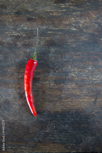 red hot chilli peppers on wooden background