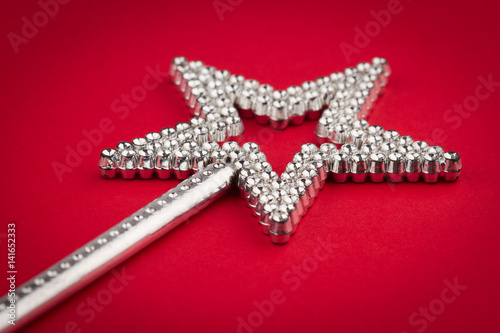 crystal star wand on red background
